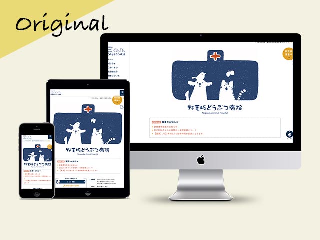 a computer and tablet with a cartoon on the screen